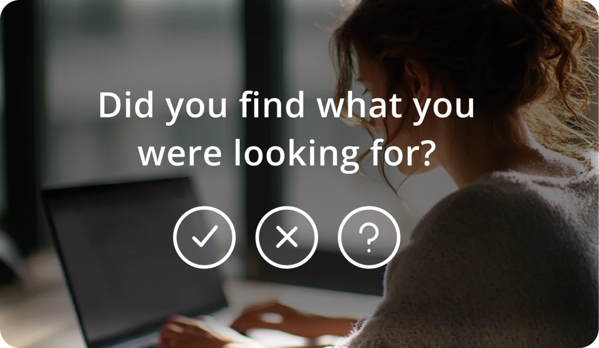 A website visitor at a laptop, overlaid with Askem's question 'Did you find what you were looking for?' and its three reaction buttons